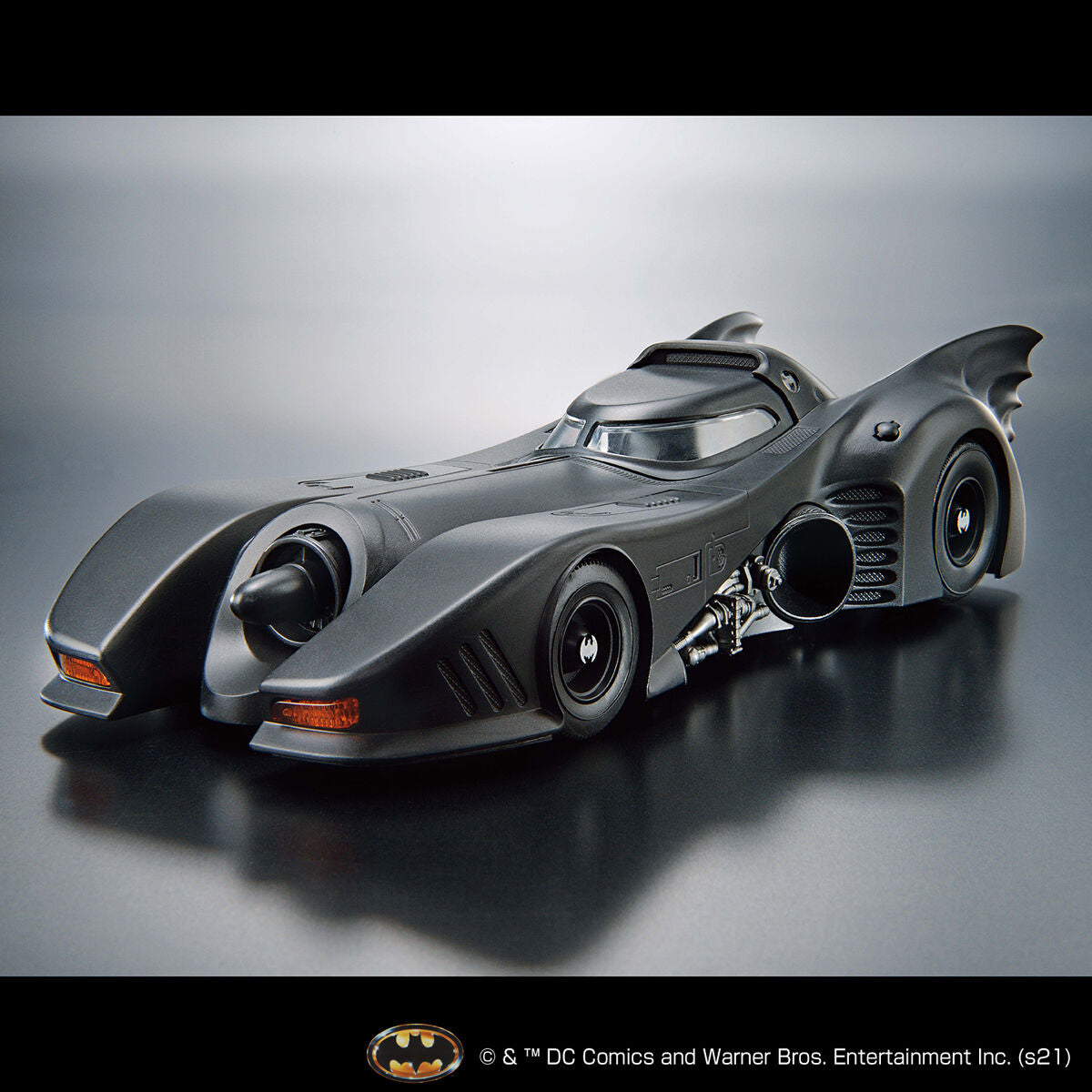 Image alt text: Batman - 1/35 Scale Batmobile (Batman Ver.) - Model Kit, intricately sculpted parts, slideable roof section, meticulously reproduced cockpit interior and mechanical details, deployment of machine guns and rocket anchors, Nippon Figures.