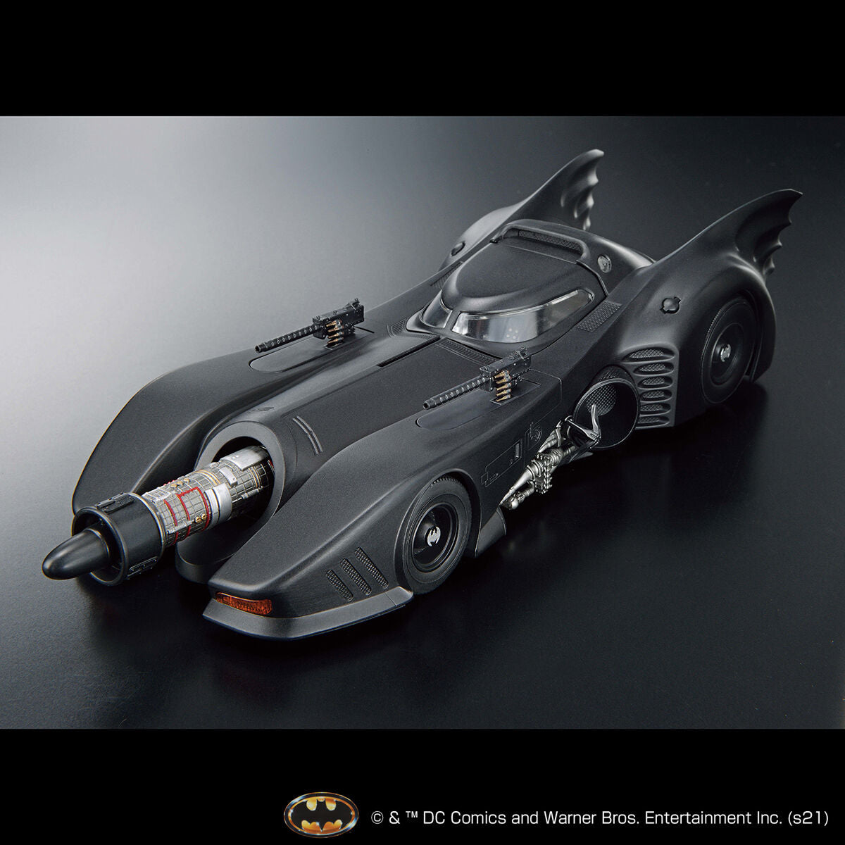 Image alt text: Batman - 1/35 Scale Batmobile (Batman Ver.) - Model Kit, intricately sculpted parts, slideable roof section, meticulously reproduced cockpit interior and mechanical details, deployment of machine guns and rocket anchors, Nippon Figures.