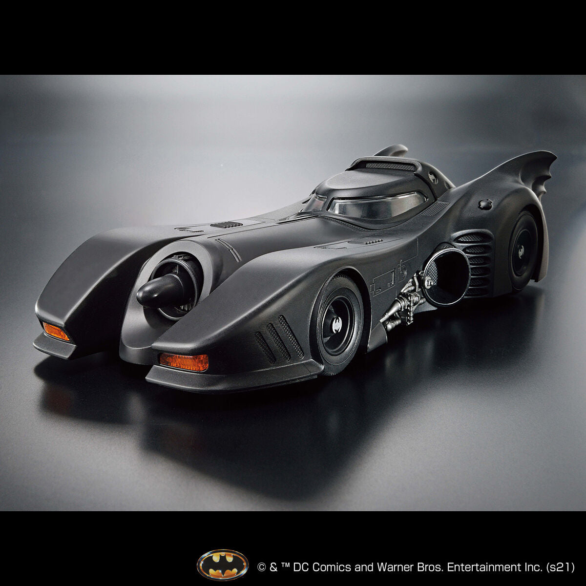 Image alt text: Batman - 1/35 Scale Batmobile (Batman Ver.) - Model Kit, intricately sculpted parts, slideable roof section, meticulously reproduced cockpit interior and mechanical details, deployment of machine guns and rocket anchors, Nippon Figures.