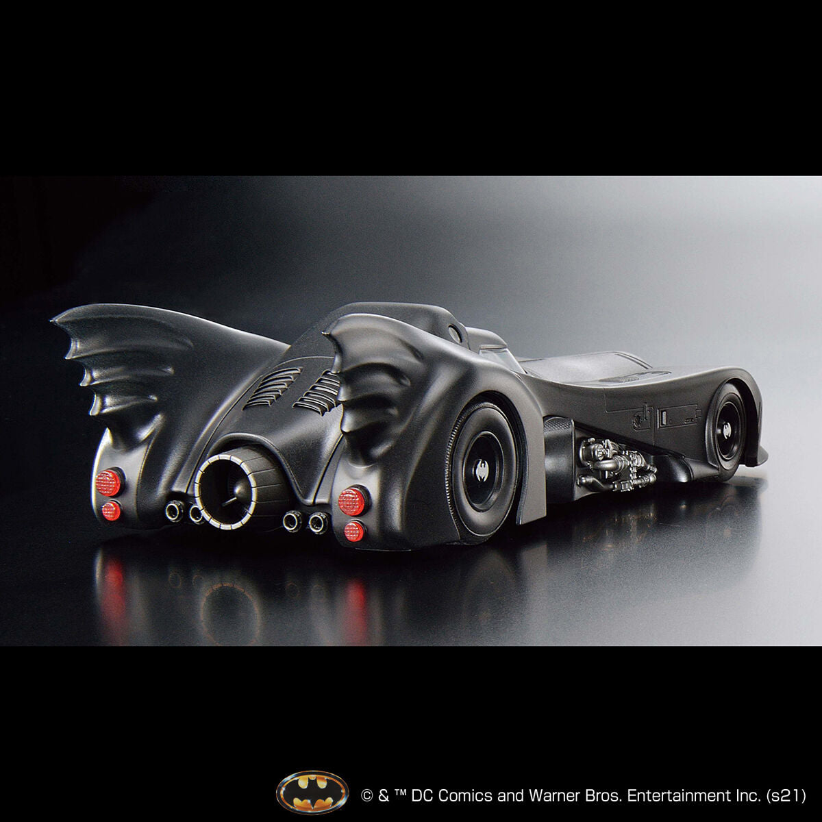 Image alt text: Batman - 1/35 Scale Batmobile (Batman Ver.) - Model Kit, intricately sculpted parts, slideable roof section, meticulously reproduced cockpit interior and mechanical details, deployment of machine guns and rocket anchors, Nippon Figures.