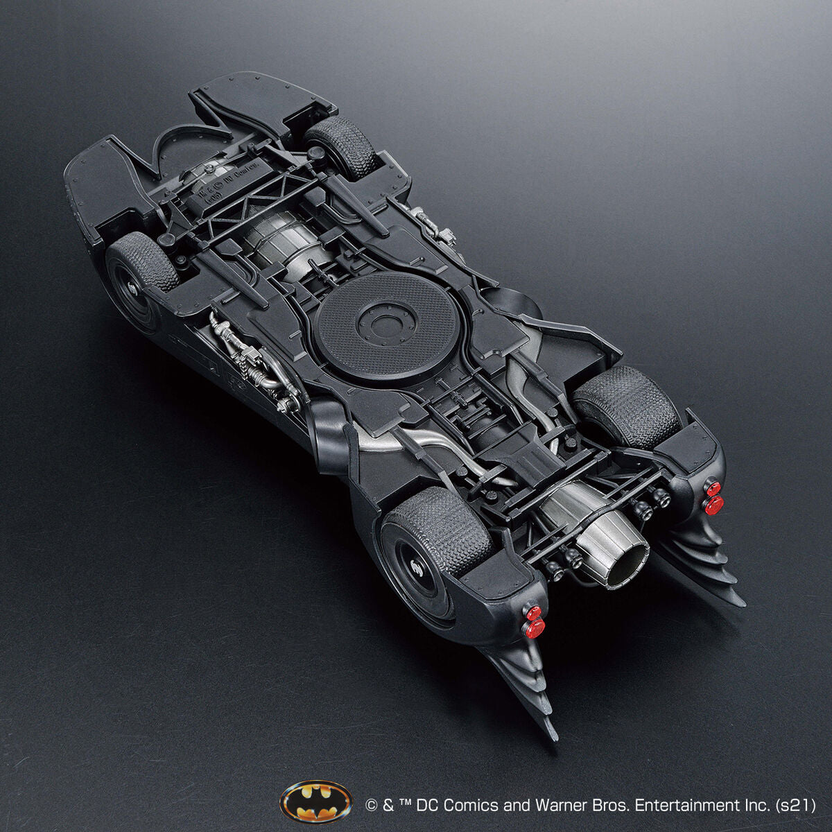 Image alt text: Batman - 1/35 Scale Batmobile (Batman Ver.) - Model Kit, intricately sculpted parts, slideable roof section, meticulously reproduced cockpit interior and mechanical details, deployment of machine guns and rocket anchors, Nippon Figures.