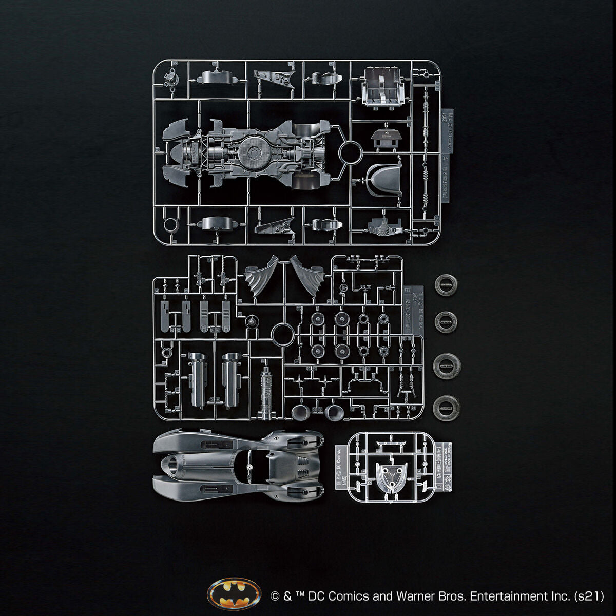 Image alt text: Batman - 1/35 Scale Batmobile (Batman Ver.) - Model Kit, intricately sculpted parts, slideable roof section, meticulously reproduced cockpit interior and mechanical details, deployment of machine guns and rocket anchors, Nippon Figures.