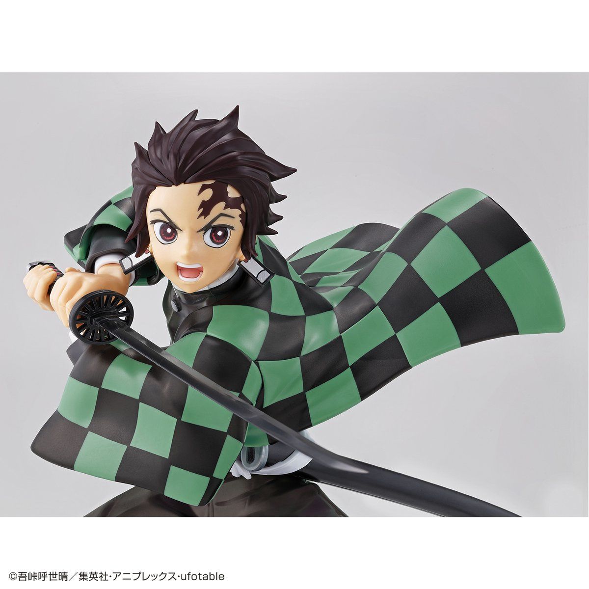 Demon Slayer - Kamado Tanjiro - Kimetsu no Yaiba Model Kit (Bandai), Non-articulated model of Tanjiro wielding Nichirin sword, includes face parts using "insert molding" technique, pre-painted haori part, Nichirin sword, stickers, and instruction manual. Franchise: Demon Slayer, Brand: Bandai, Release Date: 2020-12-19, Type: Model Kit. Sold at Nippon Figures.