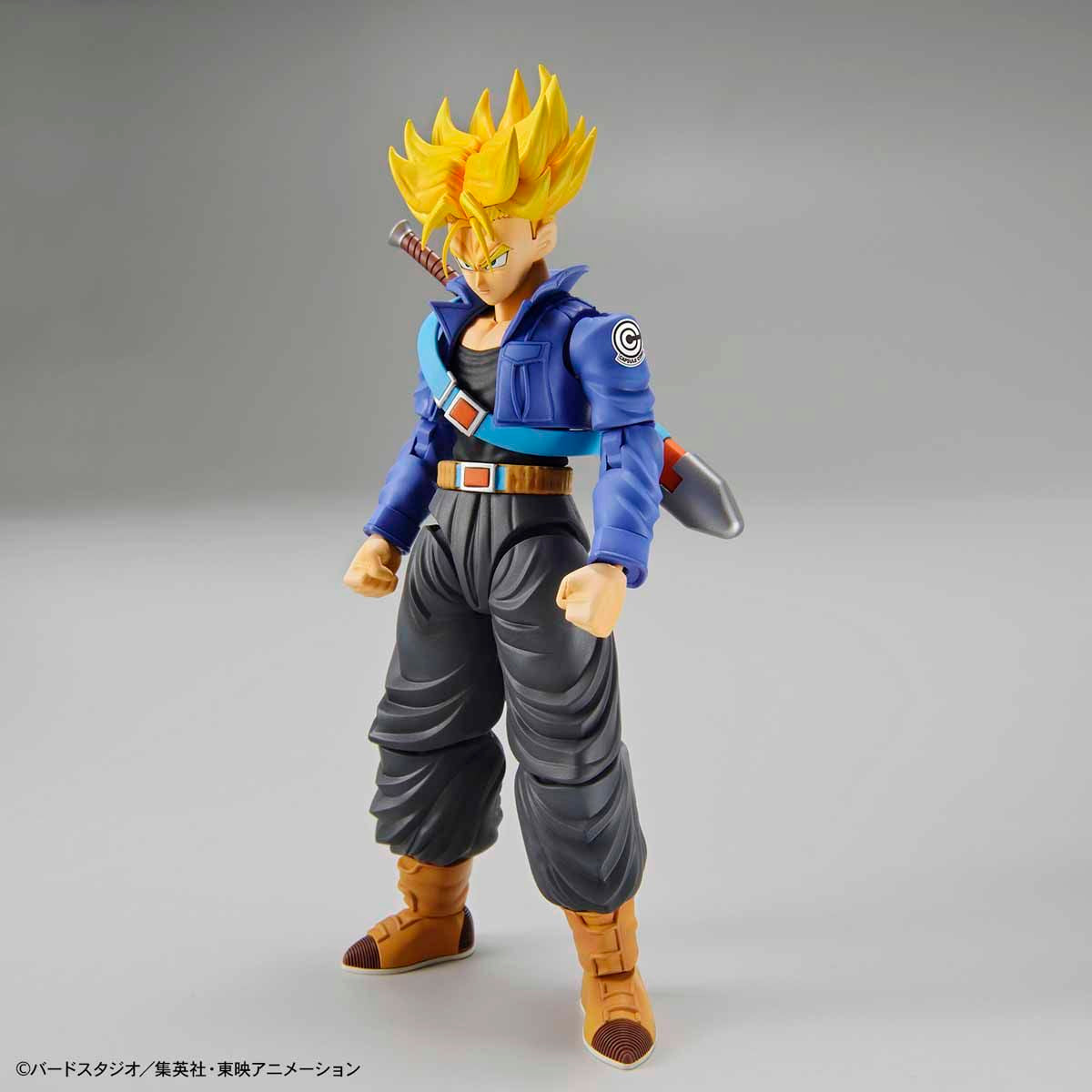 Dragon Ball - Super Saiyan Trunks - Figure-rise Standard Model Kit, Includes two head parts for Trunks in normal and Super Saiyan states, effect parts for Burning Attack and Shining Slash, iconic sword, and various hand parts. Compatible with Figure-rise Mechanics Trunks' Time Machine. From Bandai. Available at Nippon Figures.