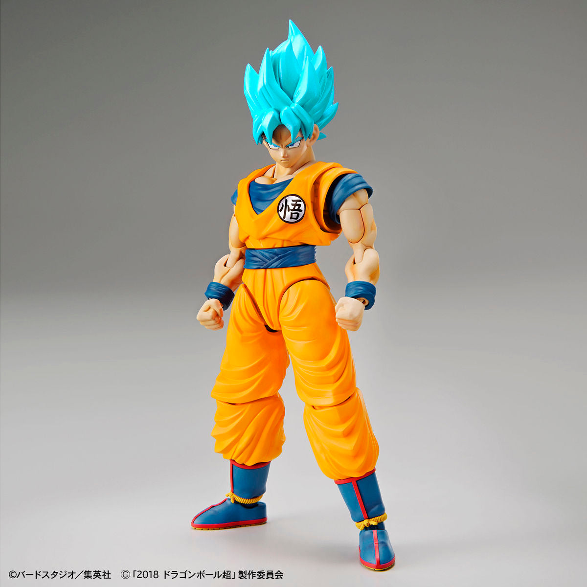 Dragon Ball - Super Saiyan God Son Goku (Special Color) - Figure-rise Standard Model Kit, Includes Special Attack Effects, Facial Expression Parts, Hand Parts, Effect Base, and Original Damage Expression Seal. Franchise: Dragon Ball, Brand: Bandai, Release Date: 2018-11-30. Store Name: Nippon Figures.