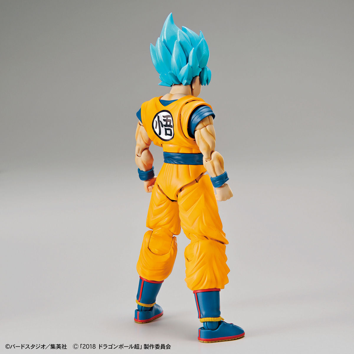 Dragon Ball - Super Saiyan God Son Goku (Special Color) - Figure-rise Standard Model Kit, Includes Special Attack Effects, Facial Expression Parts, Hand Parts, Effect Base, and Original Damage Expression Seal. Franchise: Dragon Ball, Brand: Bandai, Release Date: 2018-11-30. Store Name: Nippon Figures.