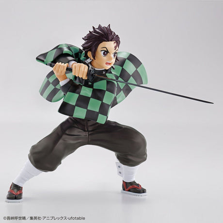 Demon Slayer - Kamado Tanjiro - Kimetsu no Yaiba Model Kit (Bandai), Non-articulated model of Tanjiro wielding Nichirin sword, includes face parts using "insert molding" technique, pre-painted haori part, Nichirin sword, stickers, and instruction manual. Franchise: Demon Slayer, Brand: Bandai, Release Date: 2020-12-19, Type: Model Kit. Sold at Nippon Figures.